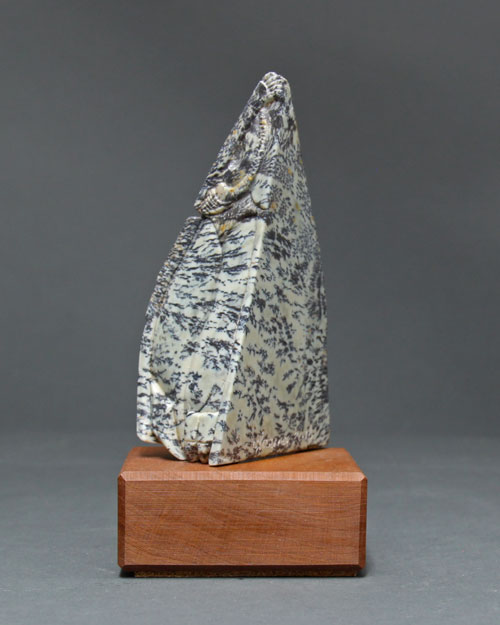 A side view of the dendritic Soapstone Owl #24 by Clarence P. Cameron of Madison, Wisconsin