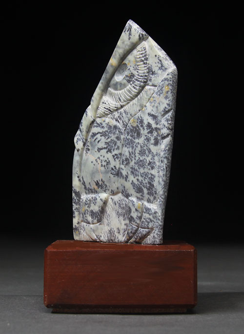 A side view of dendritic Soapstone Owl #21 by Clarence P. Cameron of Madison, Wisconsin