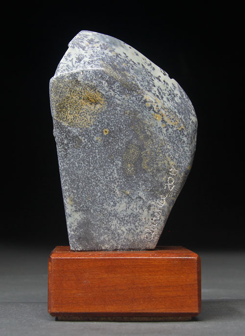 A view of the back of dendritic Soapstone Owl #21 by Clarence P. Cameron of Madison, Wisconsin