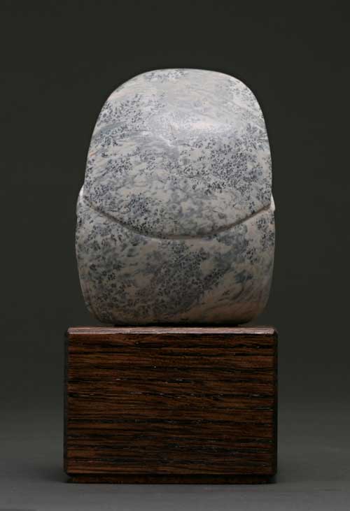 The back of dendritic Soapstone Owl #18 by Clarence P. Cameron of Madison, Wisconsin