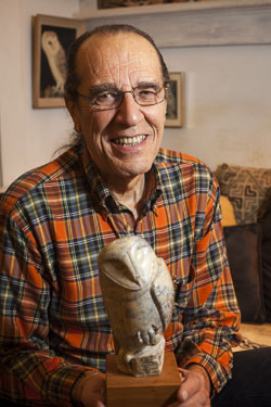 Clarence with Waiting for the Moment, a soapstone owl accepted in the 53rd Annual Society of Animal Artists Exhibition