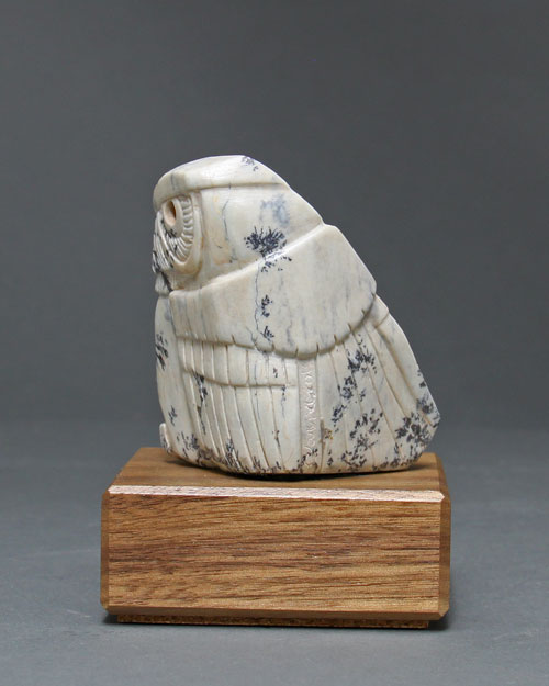 A photo of the back of Soapstone Owl #32 by Clarence P. Cameron of Madison, Wisconsin