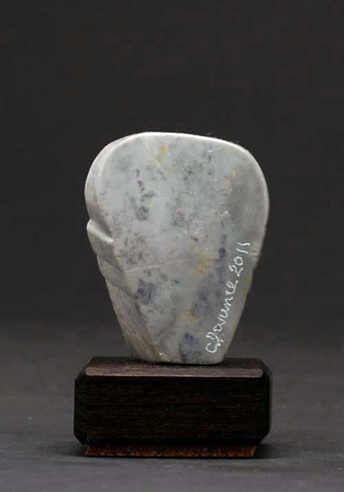 The back of Soapstone Owl #19C by Clarence P. Cameron
