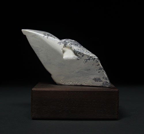 A view of the back of Soapstone Owl #3 by Clarence P. Cameron of Madison, WI
