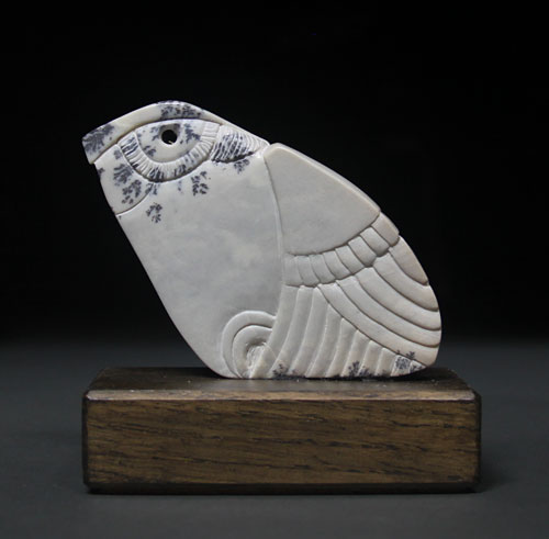 A photo of the other side of Soapstone Owl #17 by Clarence P. Cameron